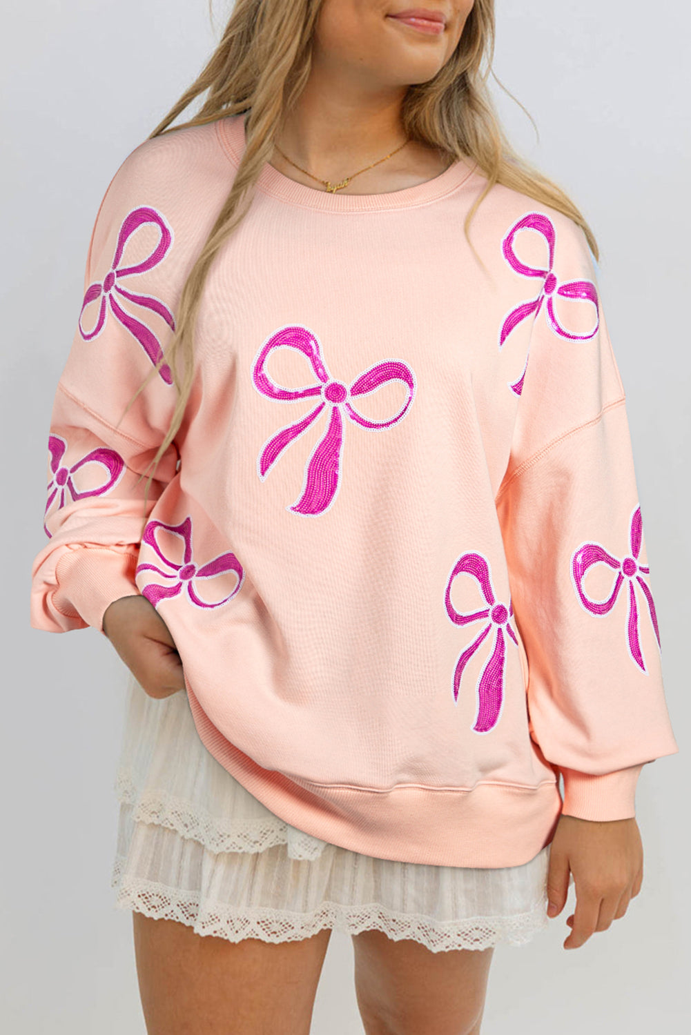 Online Apricot Pink Sequined Bowknot Drop Shoulder Oversized Sweatshirt