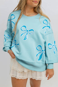 Online Apricot Pink Sequined Bowknot Drop Shoulder Oversized Sweatshirt
